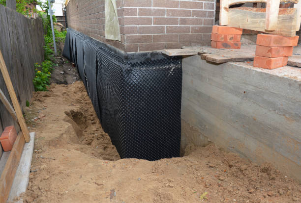 SJ Waterproofing Pros technician performing targeted Basement Waterproofing assessment in Arcade, GA